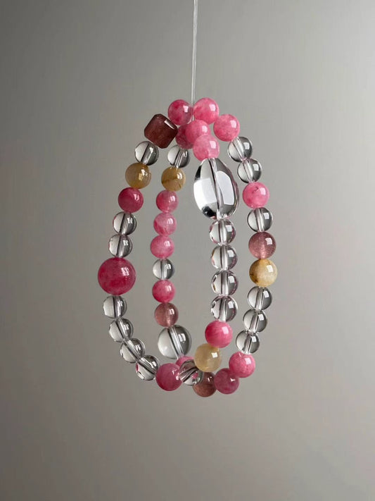 Front hero—Prosperity & Romance Matrix bracelet in pink and clear tones with Golden Rutilated Quartz accents, 11.5–7 mm