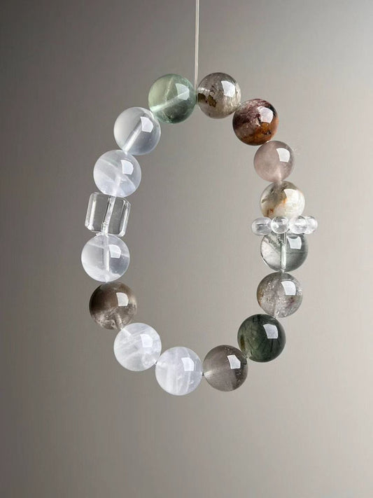 Full-length view of the multi-gem 12–13 mm bracelet; symbolic amplifier beadwork.