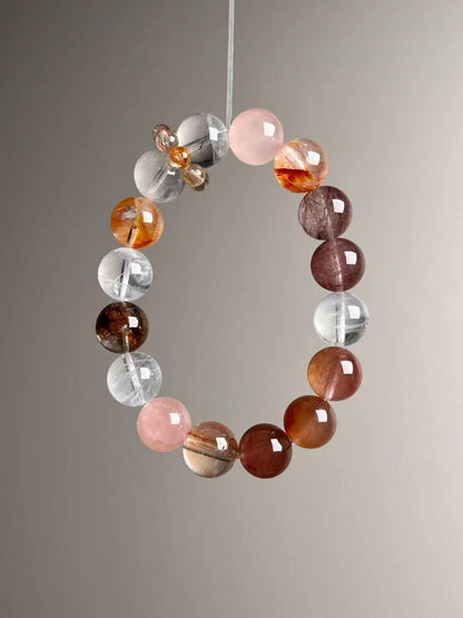 Angled hero view—mix of White Phantom Quartz, Golden Garden Quartz, red copper rutilated quartz and strand runner detail