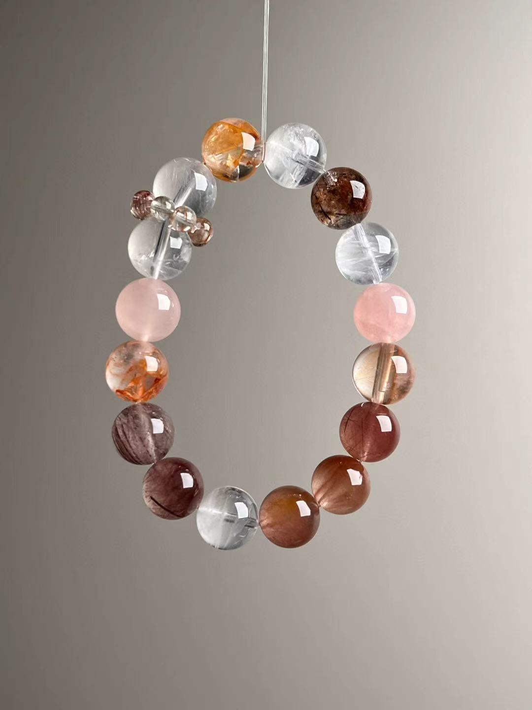 Macro texture—polished White Phantom Quartz, Golden Garden Quartz, rutilated phantom, red copper rutilated and hair quartz with rose quartz, 12 mm