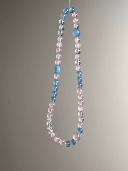 Full-length layout of the double-wrap strand with clustered clear-quartz accents near the focal zone.