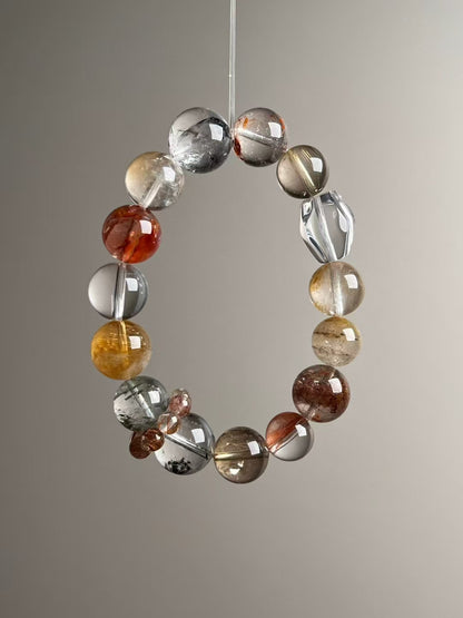 Hero angle A: Clear Quartz, Golden Rutilated Quartz & Yellow Azeztulite wealth matrix bracelet (13.5–11 mm).