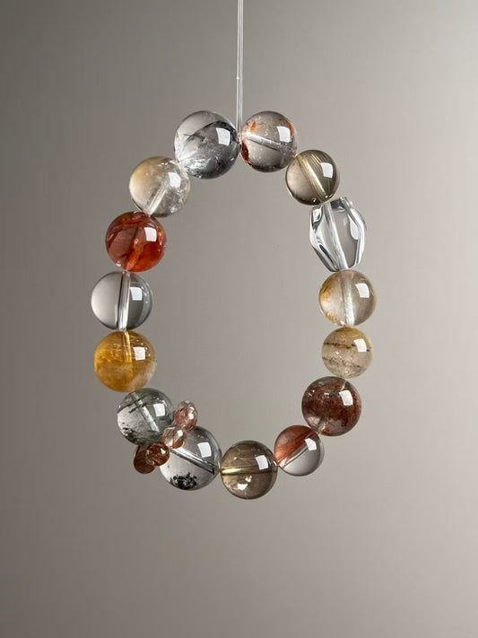 Hero angle A: Clear Quartz, Golden Rutilated Quartz & Yellow Azeztulite wealth matrix bracelet (13.5–11 mm).