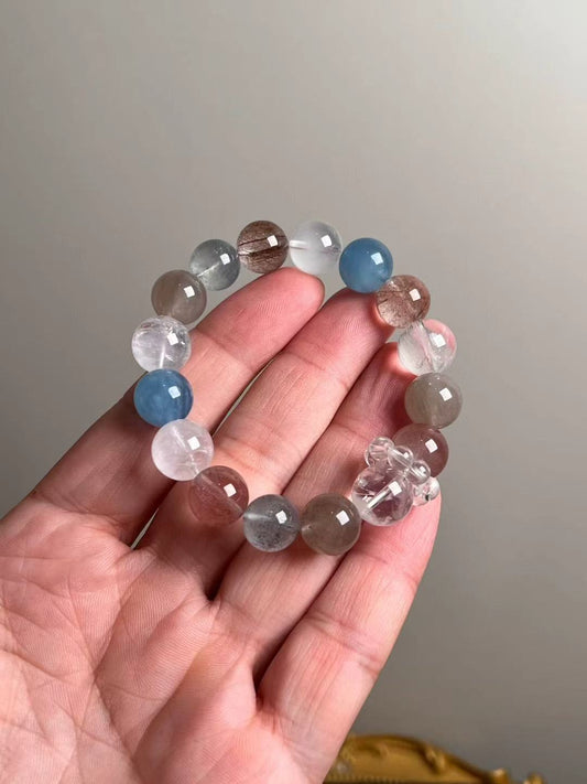 White Phantom & Aquamarine rutilated quartz bracelet—on hand for scale