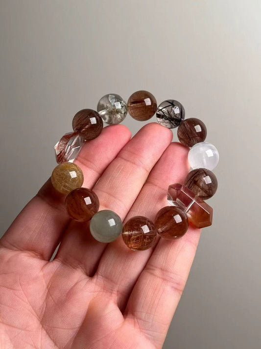 Copper rutile & multi-gem phantom quartz wealth bracelet, 13.5–14.5 mm — studio hand shot