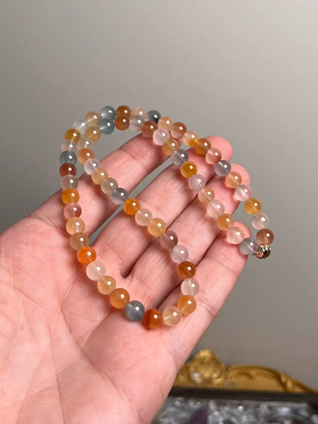 Angled hanging view highlighting peach, honey and mist-blue tones