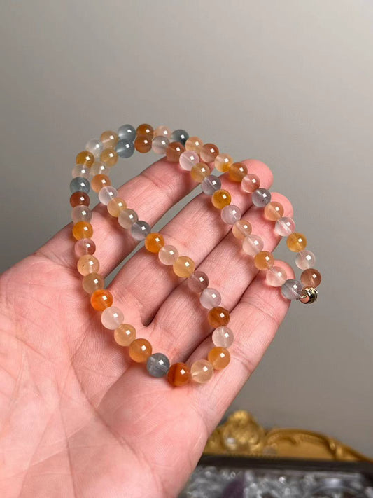 Angled hanging view highlighting peach, honey and mist-blue tones
