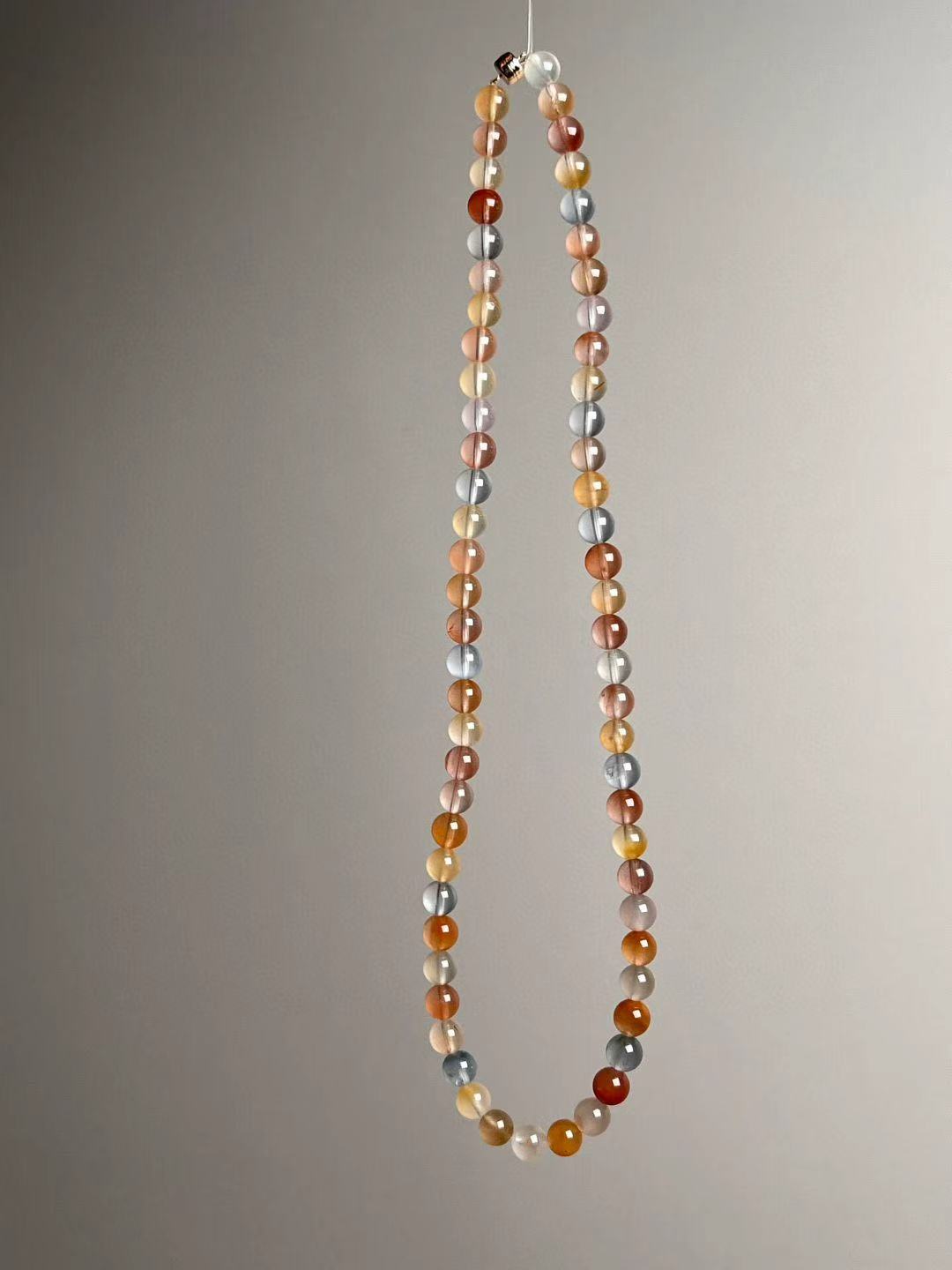 Full-length view with 7 mm beads; nickel-free clasp visible