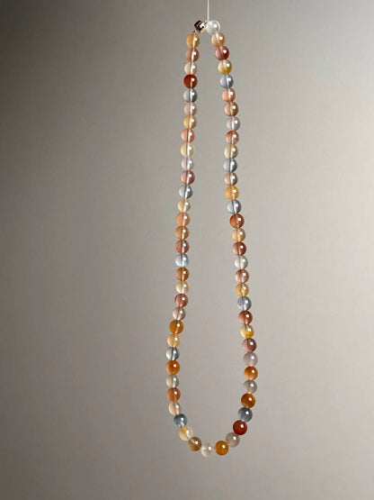 Full-length view with 7 mm beads; nickel-free clasp visible