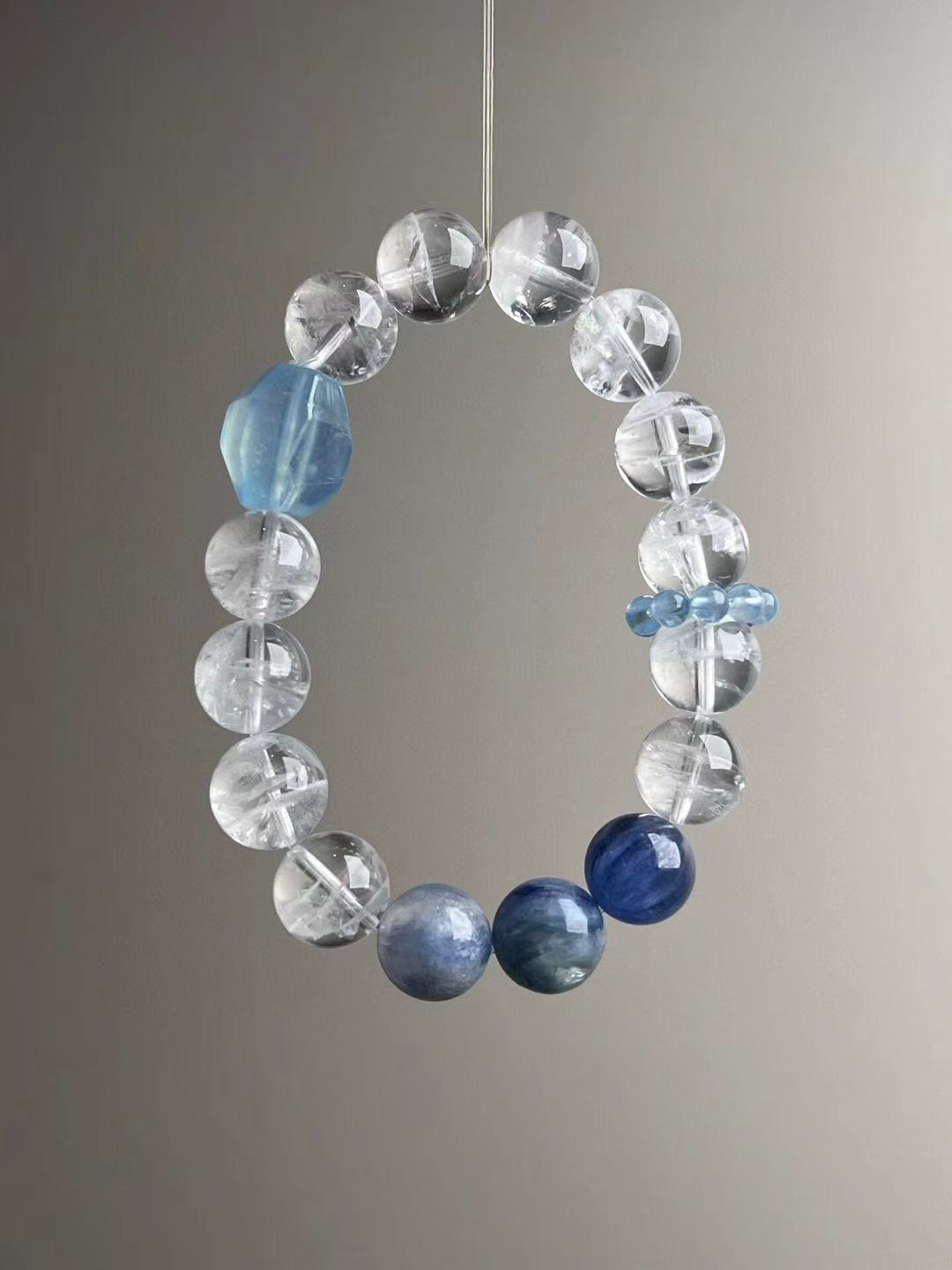 Front view with quartz clusters and pale aquamarine ‘runner ring’ discs; even polishing and clean drill lines.