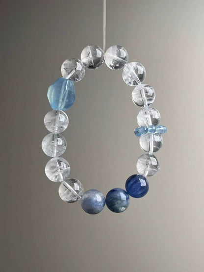 Front view with quartz clusters and pale aquamarine ‘runner ring’ discs; even polishing and clean drill lines.