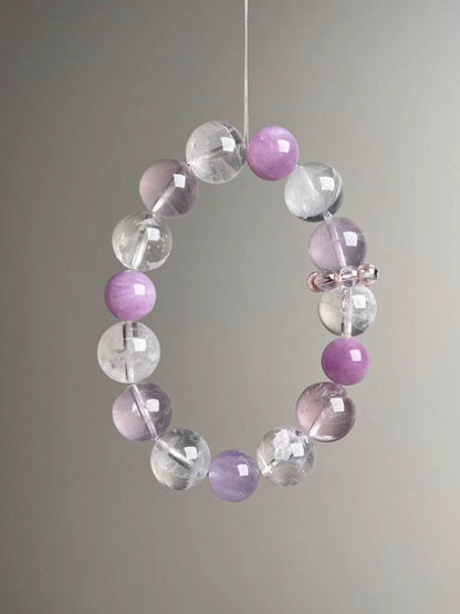 Angled hero view highlighting soft pink Rose Quartz, lilac Lepidolite and clear White Phantom beads, 14–11 mm