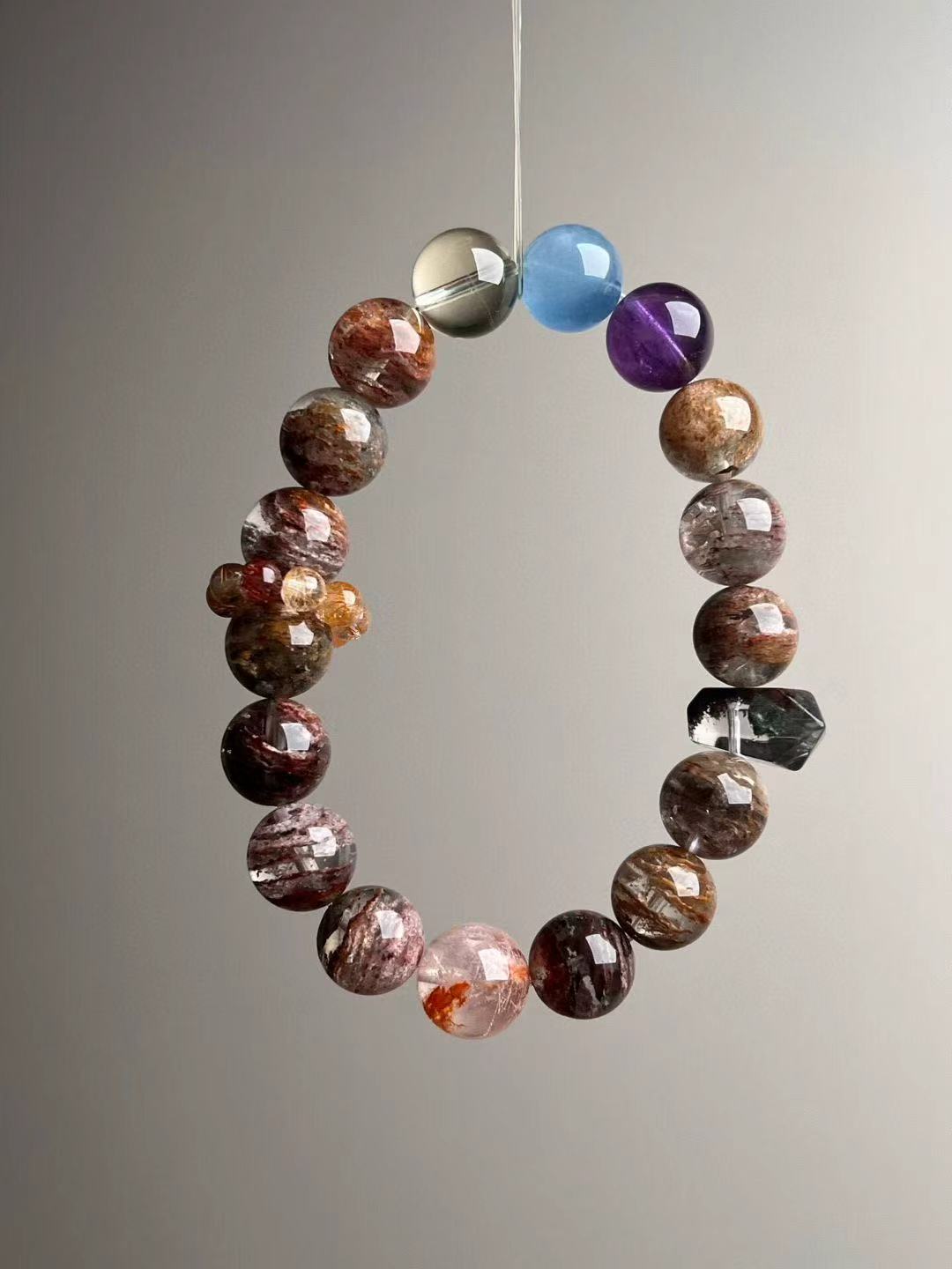 Seven-Spectrum Phantom Quartz bracelet upright view—layered phantom, amethyst, aquamarine, citrine